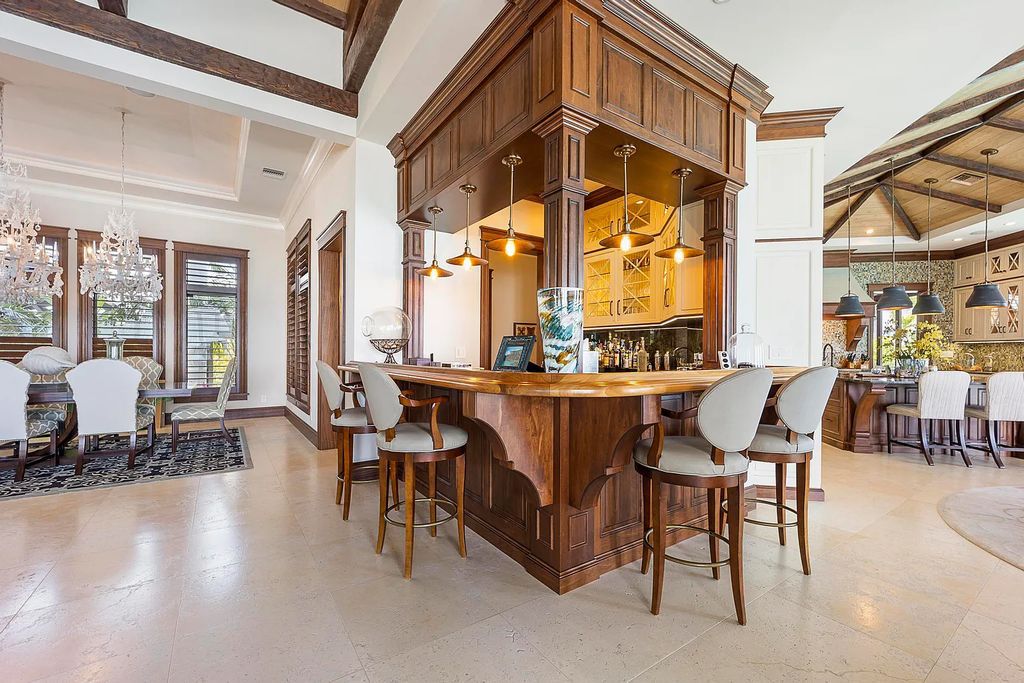 Introducing 1300 Sunset Boulevard, Tarpon Ranch—an elegant private estate in Summerland Key, Florida. Just minutes from Key West, this luxurious property offers relaxed coastal living at its finest. With 6 bedrooms, 8 bathrooms, and 7,720 square feet of living space on a 1.35-acre lot, it's a masterpiece of architectural splendor.
