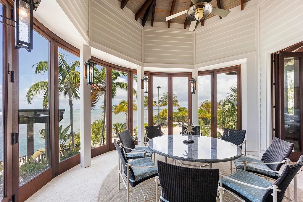 Introducing 1300 Sunset Boulevard, Tarpon Ranch—an elegant private estate in Summerland Key, Florida. Just minutes from Key West, this luxurious property offers relaxed coastal living at its finest. With 6 bedrooms, 8 bathrooms, and 7,720 square feet of living space on a 1.35-acre lot, it's a masterpiece of architectural splendor.
