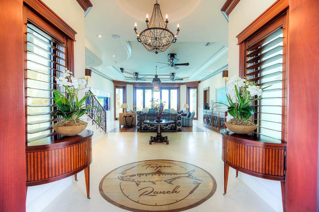 Introducing 1300 Sunset Boulevard, Tarpon Ranch—an elegant private estate in Summerland Key, Florida. Just minutes from Key West, this luxurious property offers relaxed coastal living at its finest. With 6 bedrooms, 8 bathrooms, and 7,720 square feet of living space on a 1.35-acre lot, it's a masterpiece of architectural splendor.