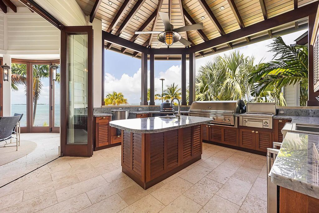 Introducing 1300 Sunset Boulevard, Tarpon Ranch—an elegant private estate in Summerland Key, Florida. Just minutes from Key West, this luxurious property offers relaxed coastal living at its finest. With 6 bedrooms, 8 bathrooms, and 7,720 square feet of living space on a 1.35-acre lot, it's a masterpiece of architectural splendor.
