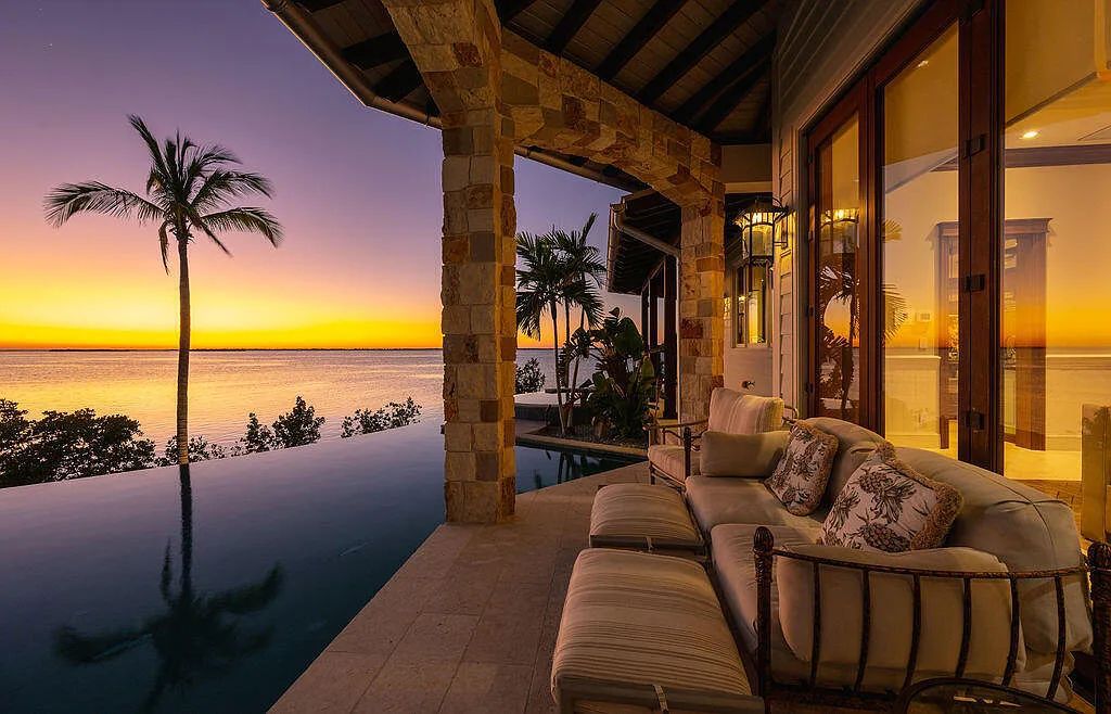 Introducing 1300 Sunset Boulevard, Tarpon Ranch—an elegant private estate in Summerland Key, Florida. Just minutes from Key West, this luxurious property offers relaxed coastal living at its finest. With 6 bedrooms, 8 bathrooms, and 7,720 square feet of living space on a 1.35-acre lot, it's a masterpiece of architectural splendor.