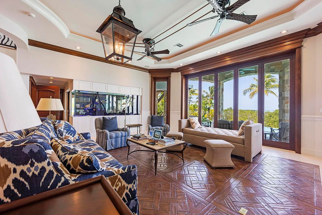 Introducing 1300 Sunset Boulevard, Tarpon Ranch—an elegant private estate in Summerland Key, Florida. Just minutes from Key West, this luxurious property offers relaxed coastal living at its finest. With 6 bedrooms, 8 bathrooms, and 7,720 square feet of living space on a 1.35-acre lot, it's a masterpiece of architectural splendor.