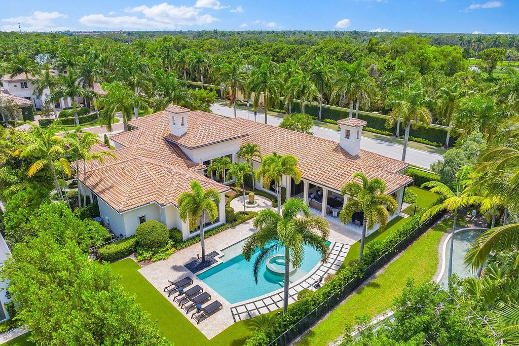 Welcome to 11771 Calleta Court, a luxurious furnished residence in Palm Beach Gardens, Florida. This exceptional home in the Grand Estates of Old Palm Golf Club offers timeless elegance, meticulous craftsmanship, and a desirable location.