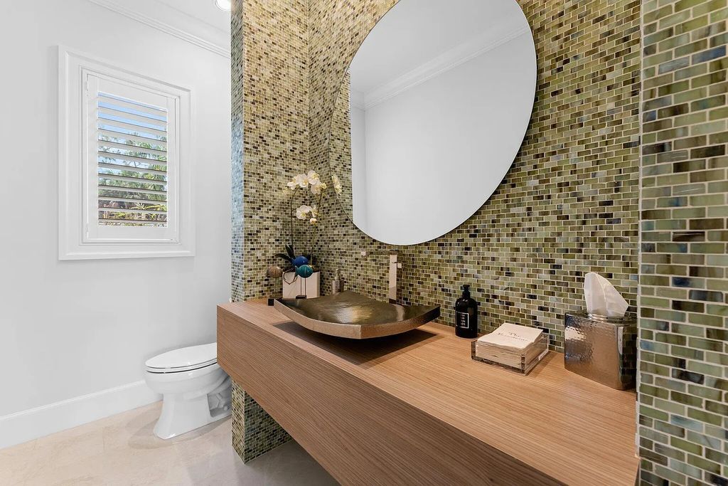 Welcome to 11771 Calleta Court, a luxurious furnished residence in Palm Beach Gardens, Florida. This exceptional home in the Grand Estates of Old Palm Golf Club offers timeless elegance, meticulous craftsmanship, and a desirable location.