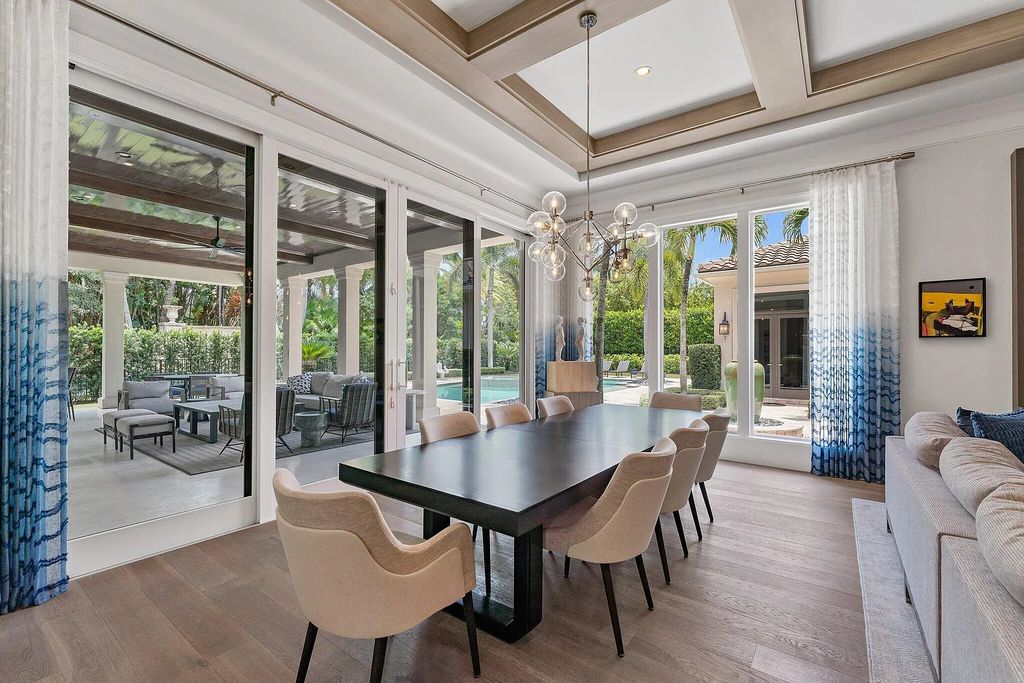 Welcome to 11771 Calleta Court, a luxurious furnished residence in Palm Beach Gardens, Florida. This exceptional home in the Grand Estates of Old Palm Golf Club offers timeless elegance, meticulous craftsmanship, and a desirable location.