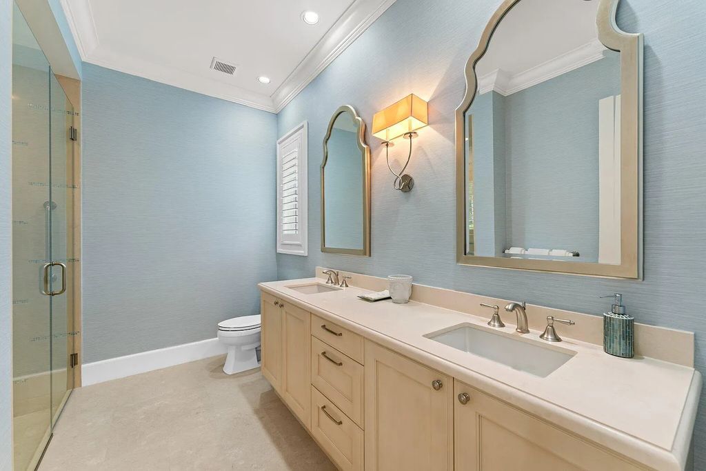 Welcome to 11771 Calleta Court, a luxurious furnished residence in Palm Beach Gardens, Florida. This exceptional home in the Grand Estates of Old Palm Golf Club offers timeless elegance, meticulous craftsmanship, and a desirable location.