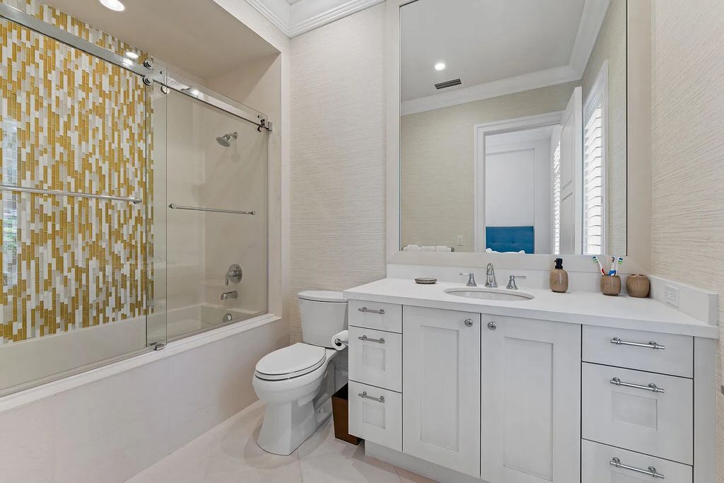 Welcome to 11771 Calleta Court, a luxurious furnished residence in Palm Beach Gardens, Florida. This exceptional home in the Grand Estates of Old Palm Golf Club offers timeless elegance, meticulous craftsmanship, and a desirable location.