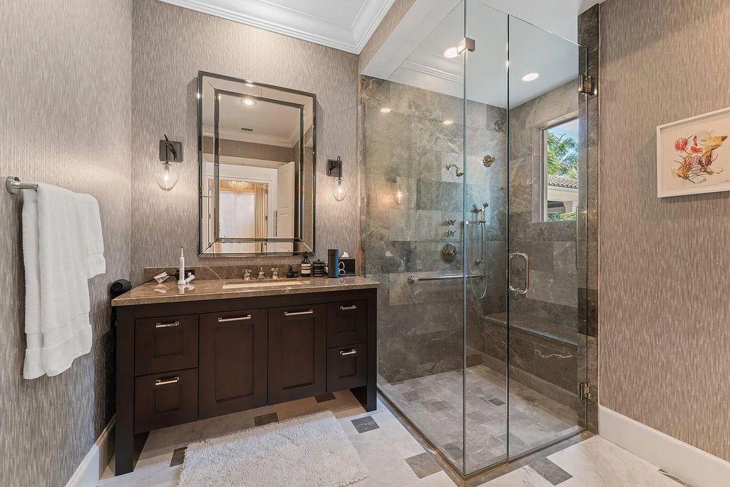 Welcome to 11771 Calleta Court, a luxurious furnished residence in Palm Beach Gardens, Florida. This exceptional home in the Grand Estates of Old Palm Golf Club offers timeless elegance, meticulous craftsmanship, and a desirable location.