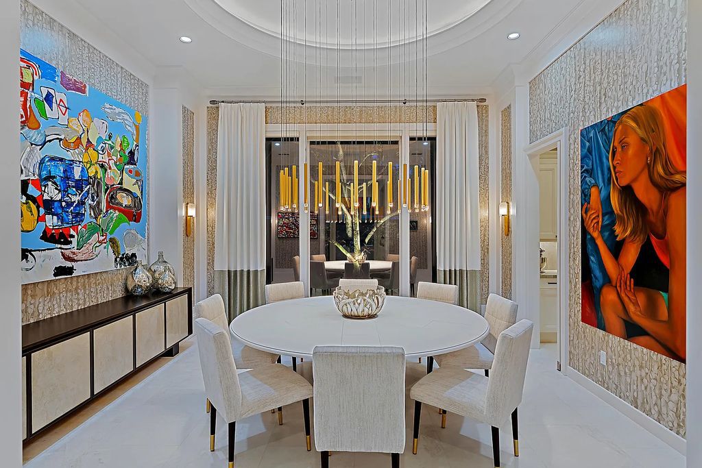 Welcome to 11771 Calleta Court, a luxurious furnished residence in Palm Beach Gardens, Florida. This exceptional home in the Grand Estates of Old Palm Golf Club offers timeless elegance, meticulous craftsmanship, and a desirable location.