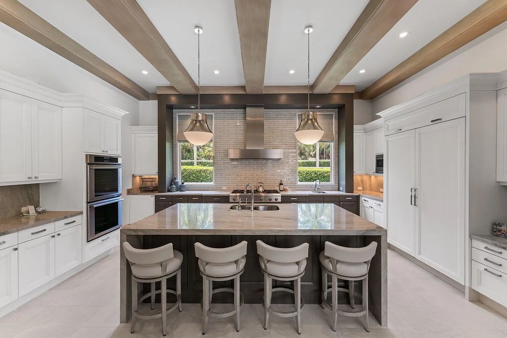 Welcome to 11771 Calleta Court, a luxurious furnished residence in Palm Beach Gardens, Florida. This exceptional home in the Grand Estates of Old Palm Golf Club offers timeless elegance, meticulous craftsmanship, and a desirable location.