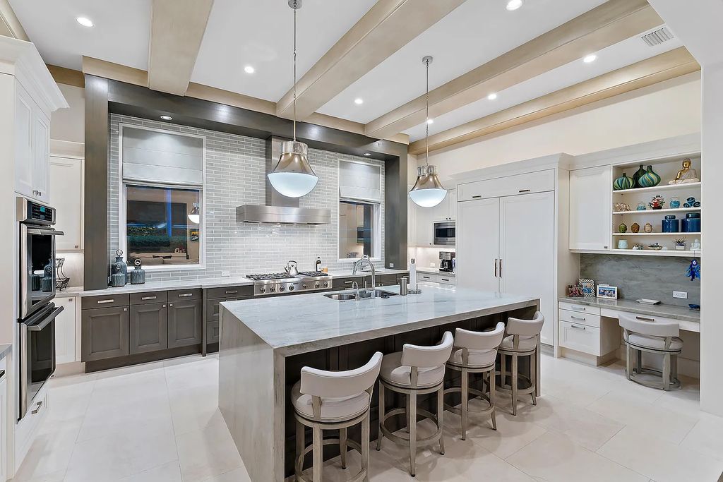 Welcome to 11771 Calleta Court, a luxurious furnished residence in Palm Beach Gardens, Florida. This exceptional home in the Grand Estates of Old Palm Golf Club offers timeless elegance, meticulous craftsmanship, and a desirable location.