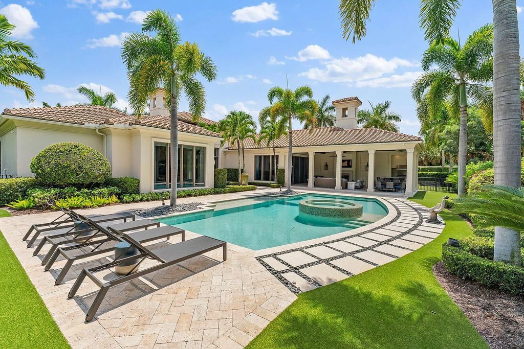 Welcome to 11771 Calleta Court, a luxurious furnished residence in Palm Beach Gardens, Florida. This exceptional home in the Grand Estates of Old Palm Golf Club offers timeless elegance, meticulous craftsmanship, and a desirable location.