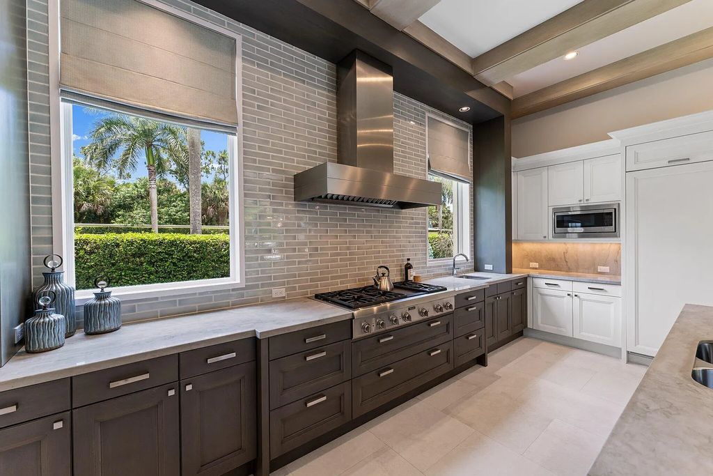 Welcome to 11771 Calleta Court, a luxurious furnished residence in Palm Beach Gardens, Florida. This exceptional home in the Grand Estates of Old Palm Golf Club offers timeless elegance, meticulous craftsmanship, and a desirable location.