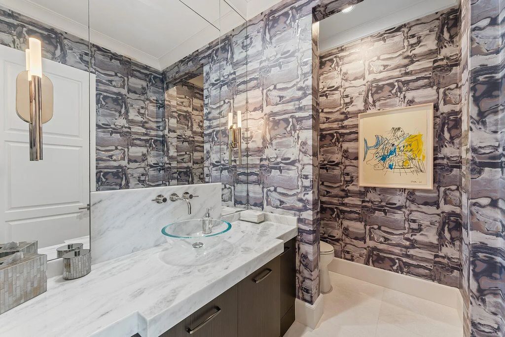 Welcome to 11771 Calleta Court, a luxurious furnished residence in Palm Beach Gardens, Florida. This exceptional home in the Grand Estates of Old Palm Golf Club offers timeless elegance, meticulous craftsmanship, and a desirable location.