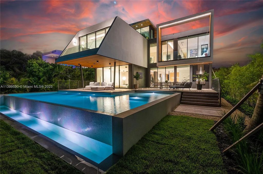 Welcome to Villa Marco at 1369 N Venetian Way, Miami Beach, Florida. Developed by Sabal Development, this masterfully crafted residence captures breathtaking bay views and natural light. With 5 beds and 6 baths spanning 7,283 sqft, it offers elegance, relaxation, and entertainment. 