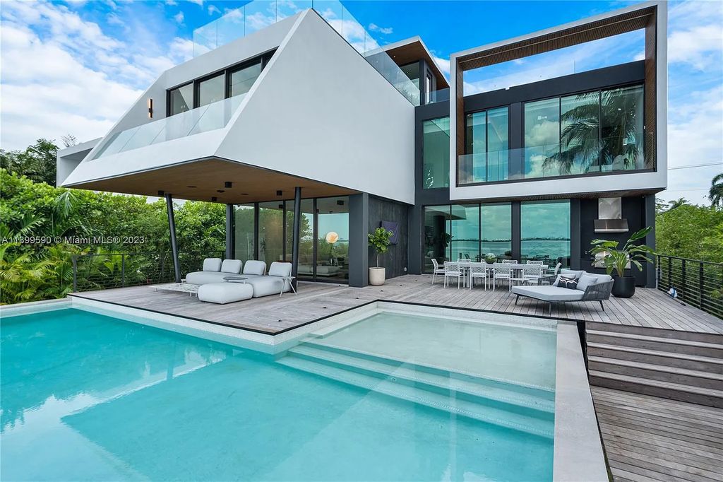 Welcome to Villa Marco at 1369 N Venetian Way, Miami Beach, Florida. Developed by Sabal Development, this masterfully crafted residence captures breathtaking bay views and natural light. With 5 beds and 6 baths spanning 7,283 sqft, it offers elegance, relaxation, and entertainment. 