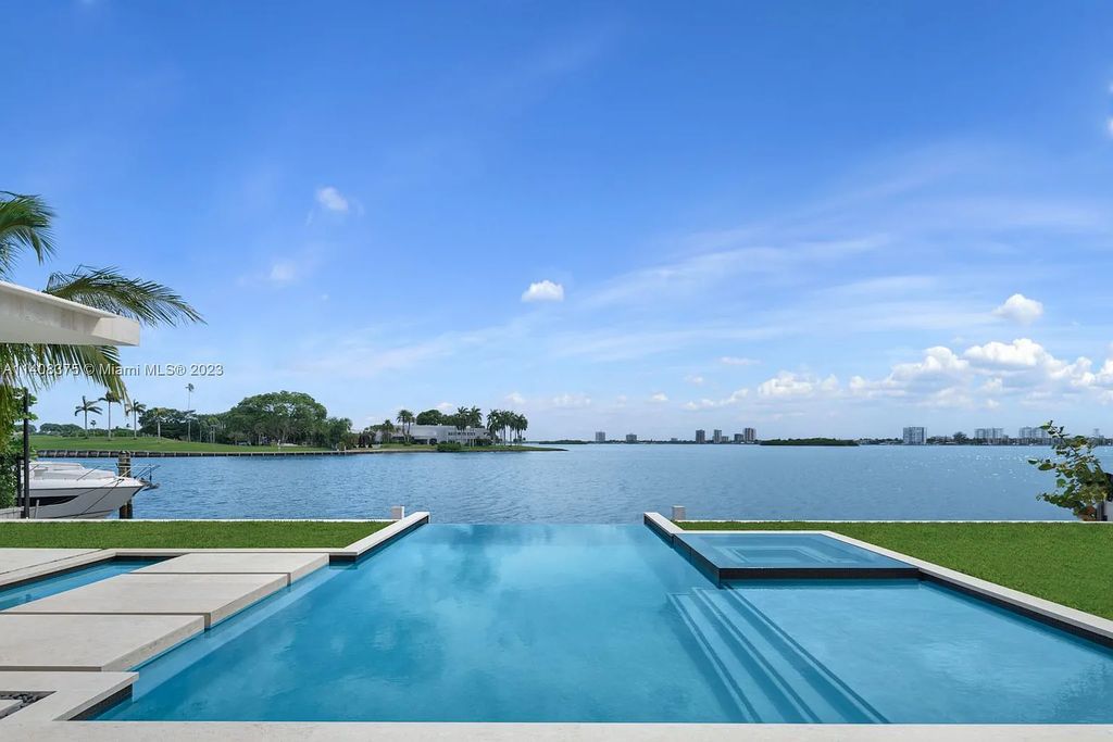 Experience luxury living at its finest in this brand-new custom residence located at 9520 W Broadview Drive, Bay Harbor Islands, Florida. With 8 bedrooms, 10 bathrooms, and over 8,200 square feet of meticulously designed living space, this modern home offers breathtaking open bay views and a seamless indoor-outdoor flow.