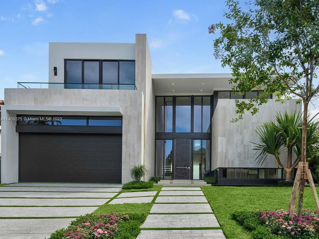 Experience luxury living at its finest in this brand-new custom residence located at 9520 W Broadview Drive, Bay Harbor Islands, Florida. With 8 bedrooms, 10 bathrooms, and over 8,200 square feet of meticulously designed living space, this modern home offers breathtaking open bay views and a seamless indoor-outdoor flow.