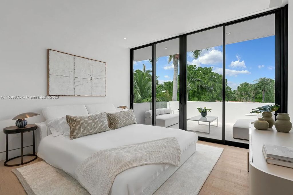 Experience luxury living at its finest in this brand-new custom residence located at 9520 W Broadview Drive, Bay Harbor Islands, Florida. With 8 bedrooms, 10 bathrooms, and over 8,200 square feet of meticulously designed living space, this modern home offers breathtaking open bay views and a seamless indoor-outdoor flow.