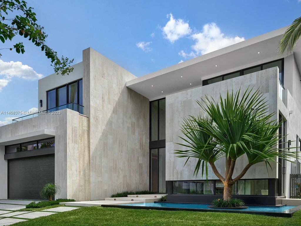 Experience luxury living at its finest in this brand-new custom residence located at 9520 W Broadview Drive, Bay Harbor Islands, Florida. With 8 bedrooms, 10 bathrooms, and over 8,200 square feet of meticulously designed living space, this modern home offers breathtaking open bay views and a seamless indoor-outdoor flow.