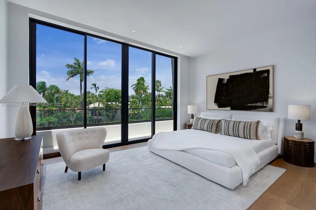 Experience luxury living at its finest in this brand-new custom residence located at 9520 W Broadview Drive, Bay Harbor Islands, Florida. With 8 bedrooms, 10 bathrooms, and over 8,200 square feet of meticulously designed living space, this modern home offers breathtaking open bay views and a seamless indoor-outdoor flow.