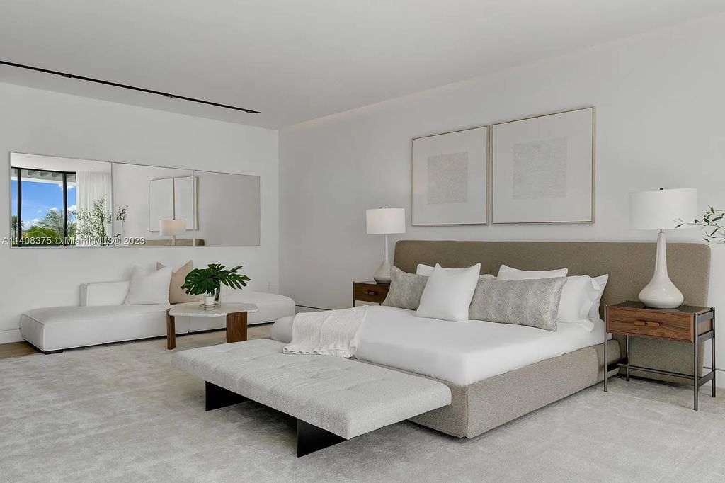 Experience luxury living at its finest in this brand-new custom residence located at 9520 W Broadview Drive, Bay Harbor Islands, Florida. With 8 bedrooms, 10 bathrooms, and over 8,200 square feet of meticulously designed living space, this modern home offers breathtaking open bay views and a seamless indoor-outdoor flow.