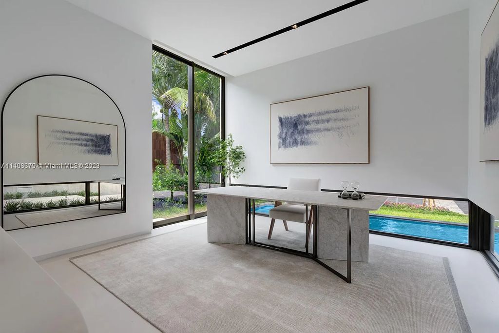 Experience luxury living at its finest in this brand-new custom residence located at 9520 W Broadview Drive, Bay Harbor Islands, Florida. With 8 bedrooms, 10 bathrooms, and over 8,200 square feet of meticulously designed living space, this modern home offers breathtaking open bay views and a seamless indoor-outdoor flow.