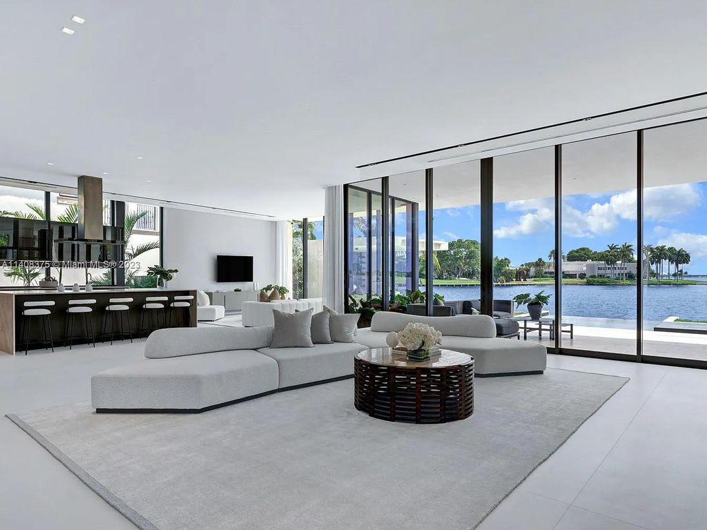 Experience luxury living at its finest in this brand-new custom residence located at 9520 W Broadview Drive, Bay Harbor Islands, Florida. With 8 bedrooms, 10 bathrooms, and over 8,200 square feet of meticulously designed living space, this modern home offers breathtaking open bay views and a seamless indoor-outdoor flow.