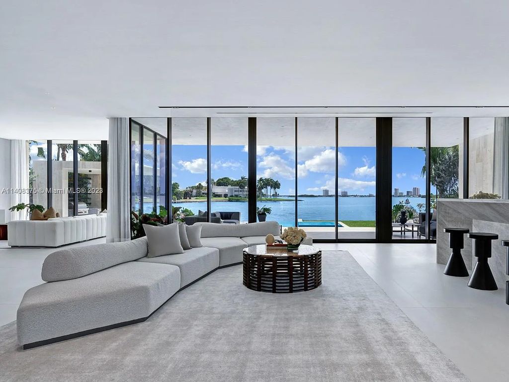 Experience luxury living at its finest in this brand-new custom residence located at 9520 W Broadview Drive, Bay Harbor Islands, Florida. With 8 bedrooms, 10 bathrooms, and over 8,200 square feet of meticulously designed living space, this modern home offers breathtaking open bay views and a seamless indoor-outdoor flow.