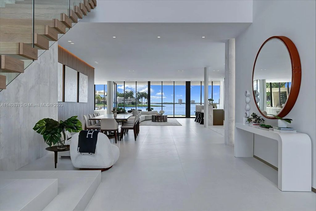 Experience luxury living at its finest in this brand-new custom residence located at 9520 W Broadview Drive, Bay Harbor Islands, Florida. With 8 bedrooms, 10 bathrooms, and over 8,200 square feet of meticulously designed living space, this modern home offers breathtaking open bay views and a seamless indoor-outdoor flow.