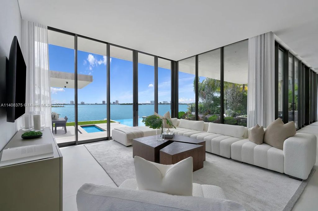 Experience luxury living at its finest in this brand-new custom residence located at 9520 W Broadview Drive, Bay Harbor Islands, Florida. With 8 bedrooms, 10 bathrooms, and over 8,200 square feet of meticulously designed living space, this modern home offers breathtaking open bay views and a seamless indoor-outdoor flow.