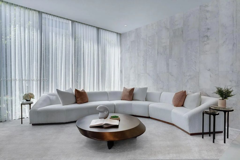 Experience luxury living at its finest in this brand-new custom residence located at 9520 W Broadview Drive, Bay Harbor Islands, Florida. With 8 bedrooms, 10 bathrooms, and over 8,200 square feet of meticulously designed living space, this modern home offers breathtaking open bay views and a seamless indoor-outdoor flow.