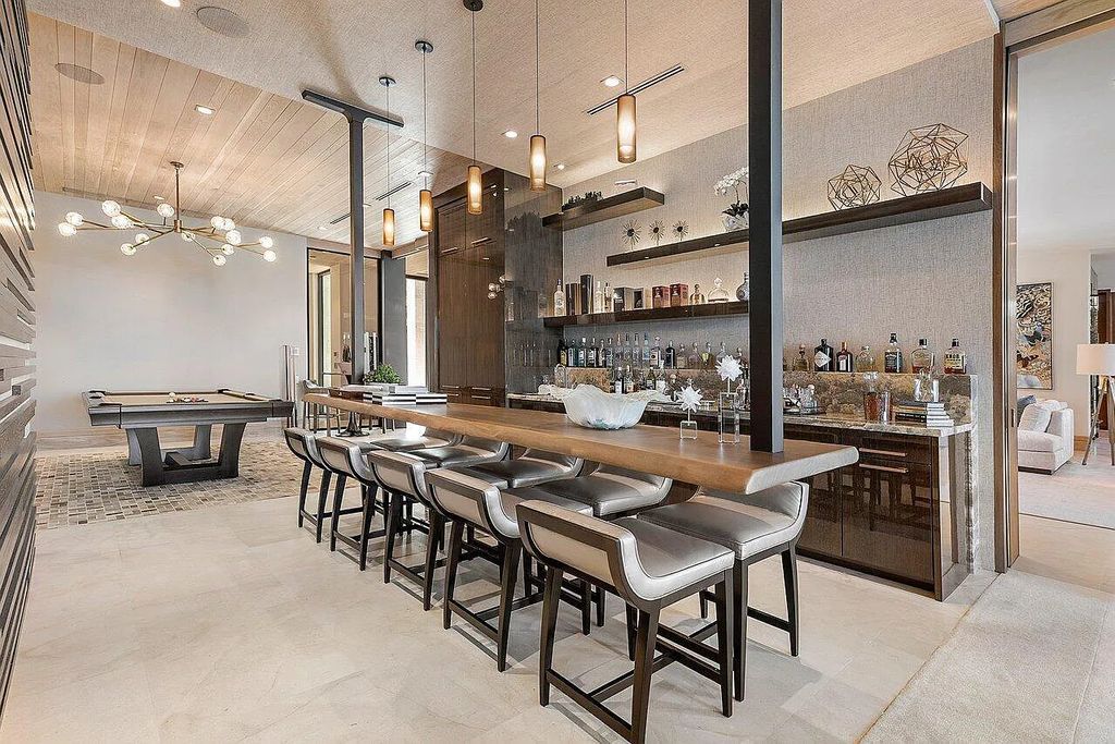 Welcome to 1115 Hillsboro Mile, a luxurious 6-bedrooms, 8-bathrooms home in Hillsboro Beach, Florida. Built in 2017 by Mark Timothy Luxury Homes and Affiniti Architects, this property offers stunning ocean views and a private boat dock.