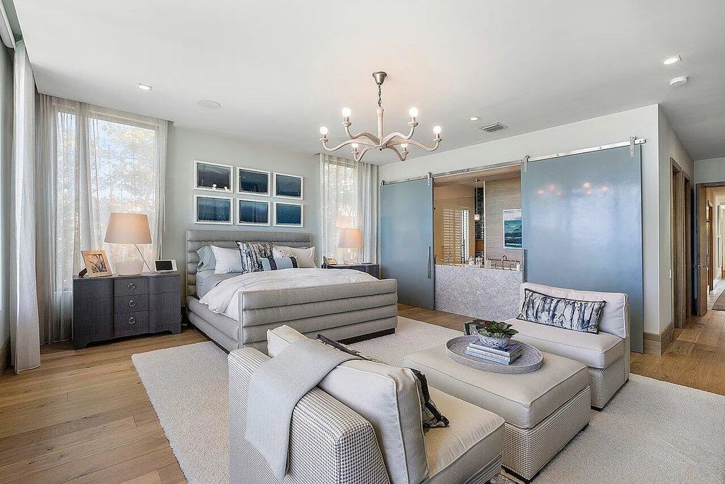 Welcome to 1115 Hillsboro Mile, a luxurious 6-bedrooms, 8-bathrooms home in Hillsboro Beach, Florida. Built in 2017 by Mark Timothy Luxury Homes and Affiniti Architects, this property offers stunning ocean views and a private boat dock.