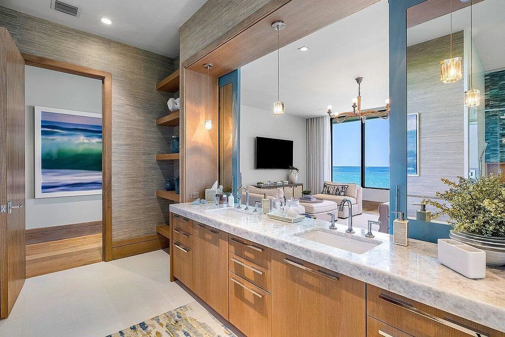 Welcome to 1115 Hillsboro Mile, a luxurious 6-bedrooms, 8-bathrooms home in Hillsboro Beach, Florida. Built in 2017 by Mark Timothy Luxury Homes and Affiniti Architects, this property offers stunning ocean views and a private boat dock.