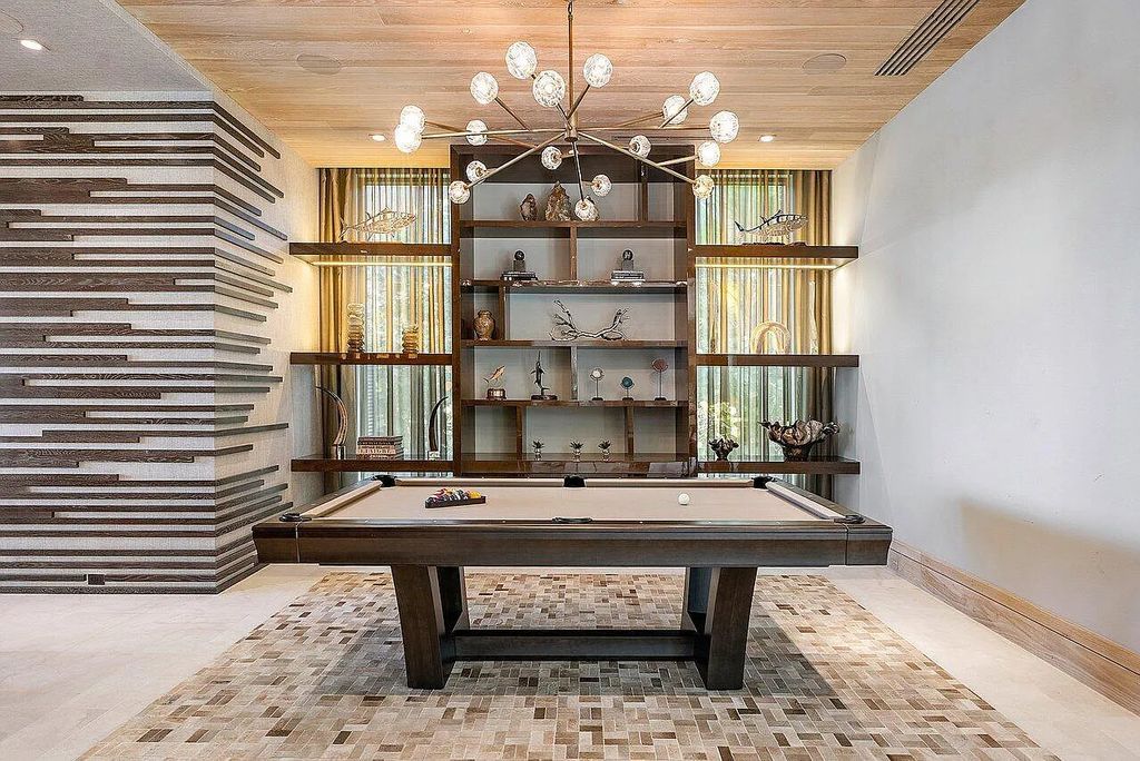 Welcome to 1115 Hillsboro Mile, a luxurious 6-bedrooms, 8-bathrooms home in Hillsboro Beach, Florida. Built in 2017 by Mark Timothy Luxury Homes and Affiniti Architects, this property offers stunning ocean views and a private boat dock.
