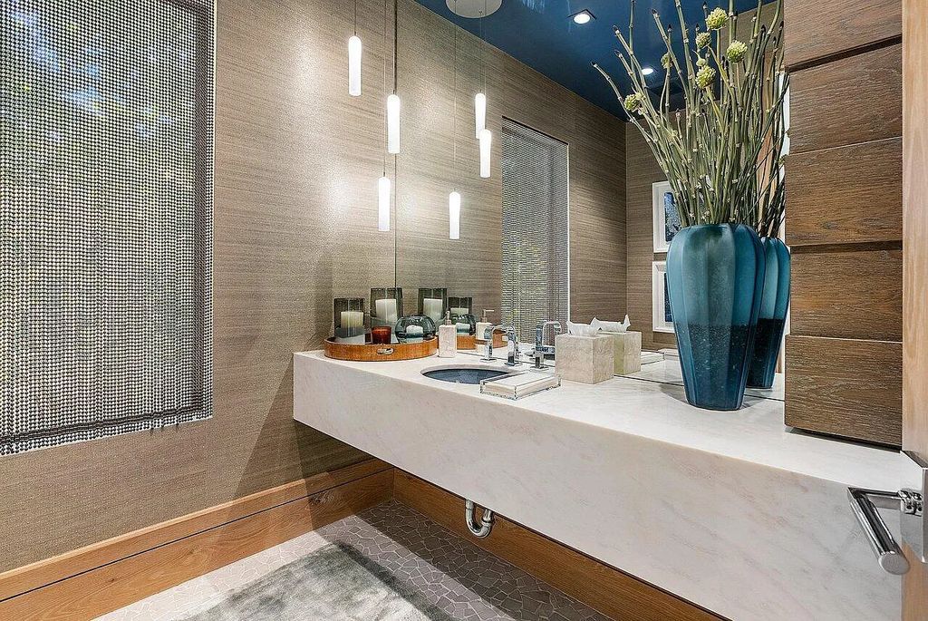 Welcome to 1115 Hillsboro Mile, a luxurious 6-bedrooms, 8-bathrooms home in Hillsboro Beach, Florida. Built in 2017 by Mark Timothy Luxury Homes and Affiniti Architects, this property offers stunning ocean views and a private boat dock.