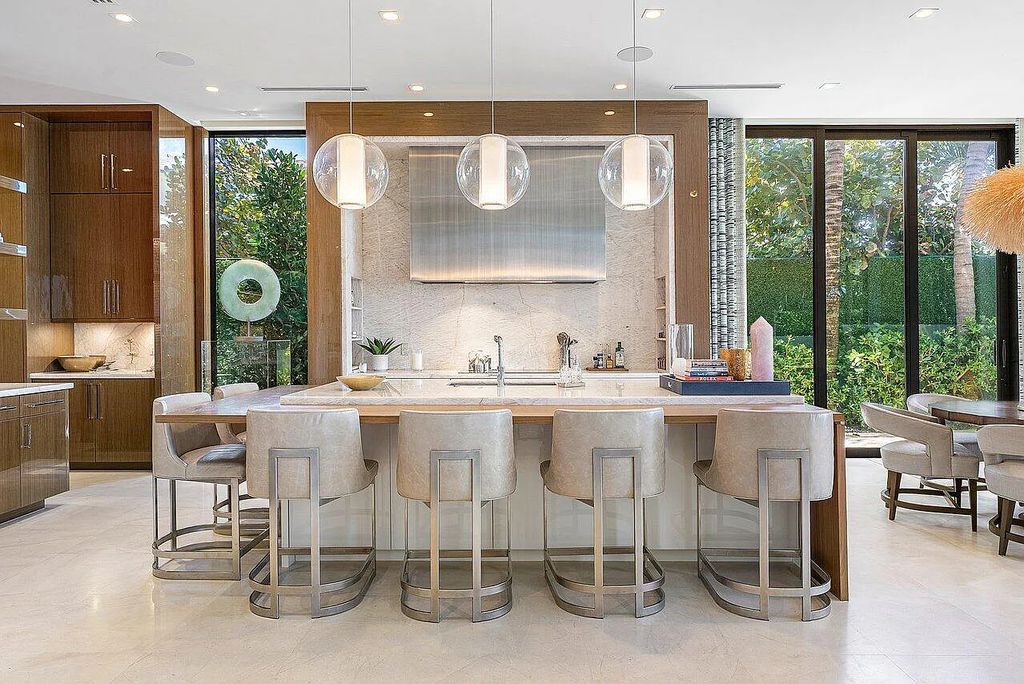 Welcome to 1115 Hillsboro Mile, a luxurious 6-bedrooms, 8-bathrooms home in Hillsboro Beach, Florida. Built in 2017 by Mark Timothy Luxury Homes and Affiniti Architects, this property offers stunning ocean views and a private boat dock.