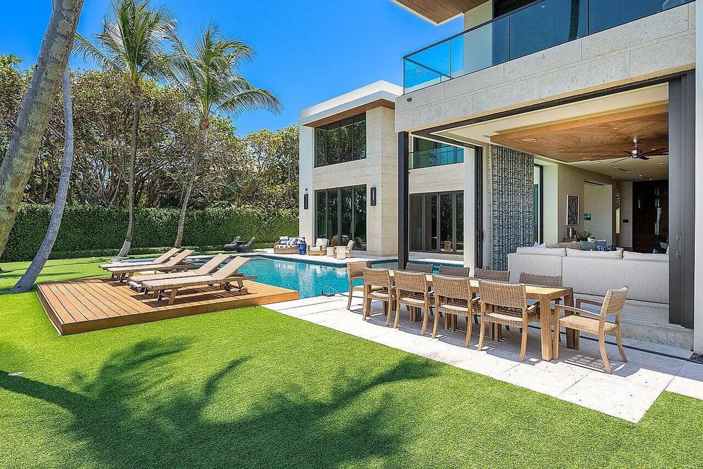 Welcome to 1115 Hillsboro Mile, a luxurious 6-bedrooms, 8-bathrooms home in Hillsboro Beach, Florida. Built in 2017 by Mark Timothy Luxury Homes and Affiniti Architects, this property offers stunning ocean views and a private boat dock.