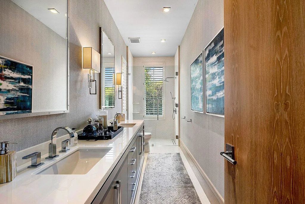 Welcome to 1115 Hillsboro Mile, a luxurious 6-bedrooms, 8-bathrooms home in Hillsboro Beach, Florida. Built in 2017 by Mark Timothy Luxury Homes and Affiniti Architects, this property offers stunning ocean views and a private boat dock.
