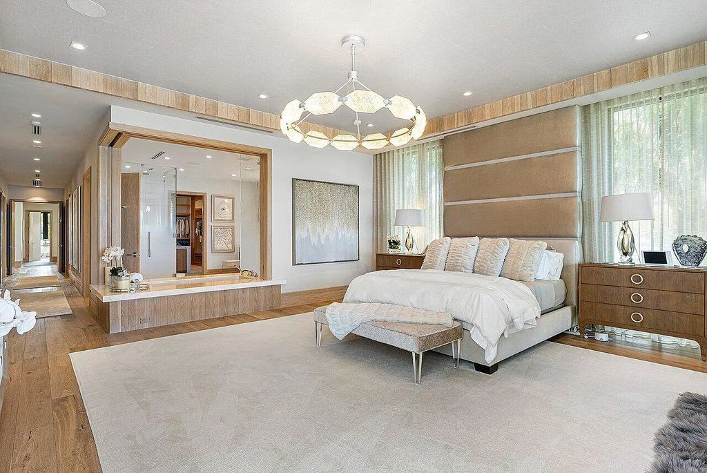 Welcome to 1115 Hillsboro Mile, a luxurious 6-bedrooms, 8-bathrooms home in Hillsboro Beach, Florida. Built in 2017 by Mark Timothy Luxury Homes and Affiniti Architects, this property offers stunning ocean views and a private boat dock.