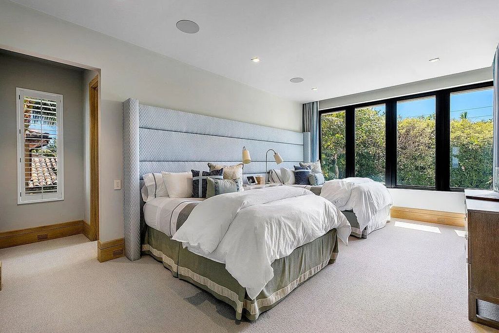 Welcome to 1115 Hillsboro Mile, a luxurious 6-bedrooms, 8-bathrooms home in Hillsboro Beach, Florida. Built in 2017 by Mark Timothy Luxury Homes and Affiniti Architects, this property offers stunning ocean views and a private boat dock.
