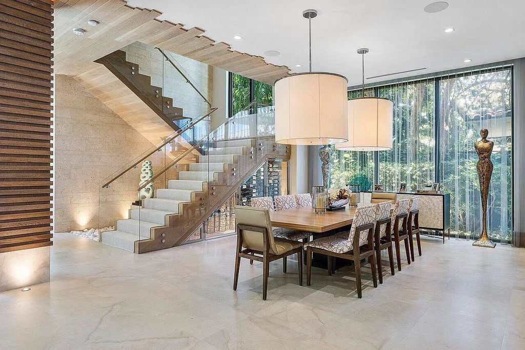 Welcome to 1115 Hillsboro Mile, a luxurious 6-bedrooms, 8-bathrooms home in Hillsboro Beach, Florida. Built in 2017 by Mark Timothy Luxury Homes and Affiniti Architects, this property offers stunning ocean views and a private boat dock.