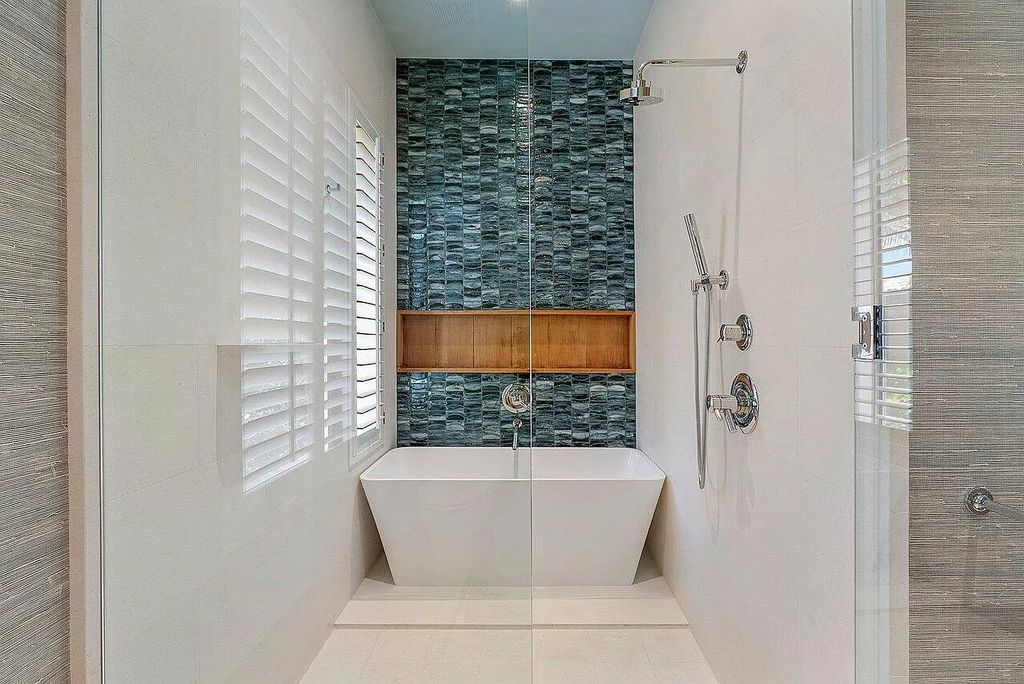 Welcome to 1115 Hillsboro Mile, a luxurious 6-bedrooms, 8-bathrooms home in Hillsboro Beach, Florida. Built in 2017 by Mark Timothy Luxury Homes and Affiniti Architects, this property offers stunning ocean views and a private boat dock.