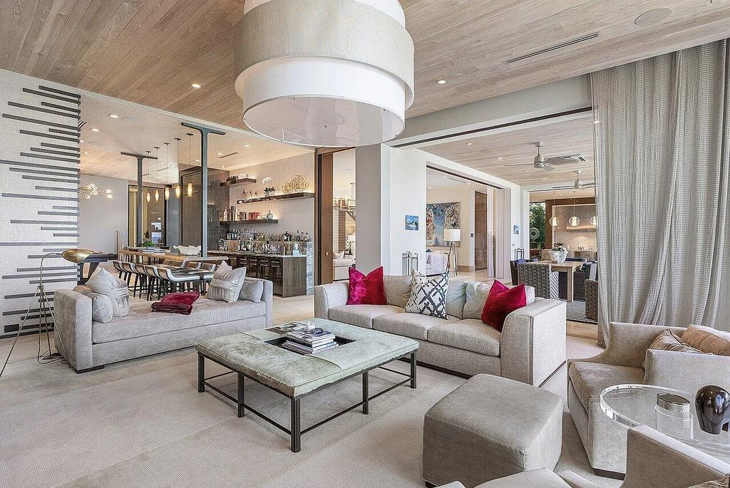 Welcome to 1115 Hillsboro Mile, a luxurious 6-bedrooms, 8-bathrooms home in Hillsboro Beach, Florida. Built in 2017 by Mark Timothy Luxury Homes and Affiniti Architects, this property offers stunning ocean views and a private boat dock.