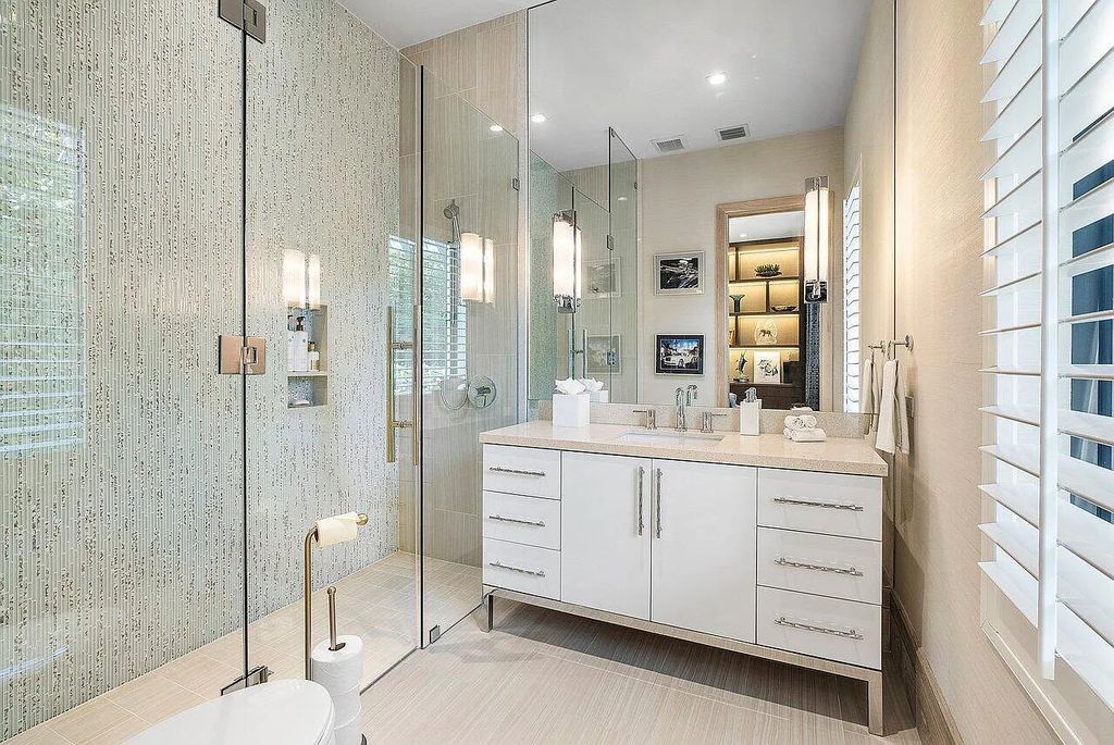 Welcome to 1115 Hillsboro Mile, a luxurious 6-bedrooms, 8-bathrooms home in Hillsboro Beach, Florida. Built in 2017 by Mark Timothy Luxury Homes and Affiniti Architects, this property offers stunning ocean views and a private boat dock.