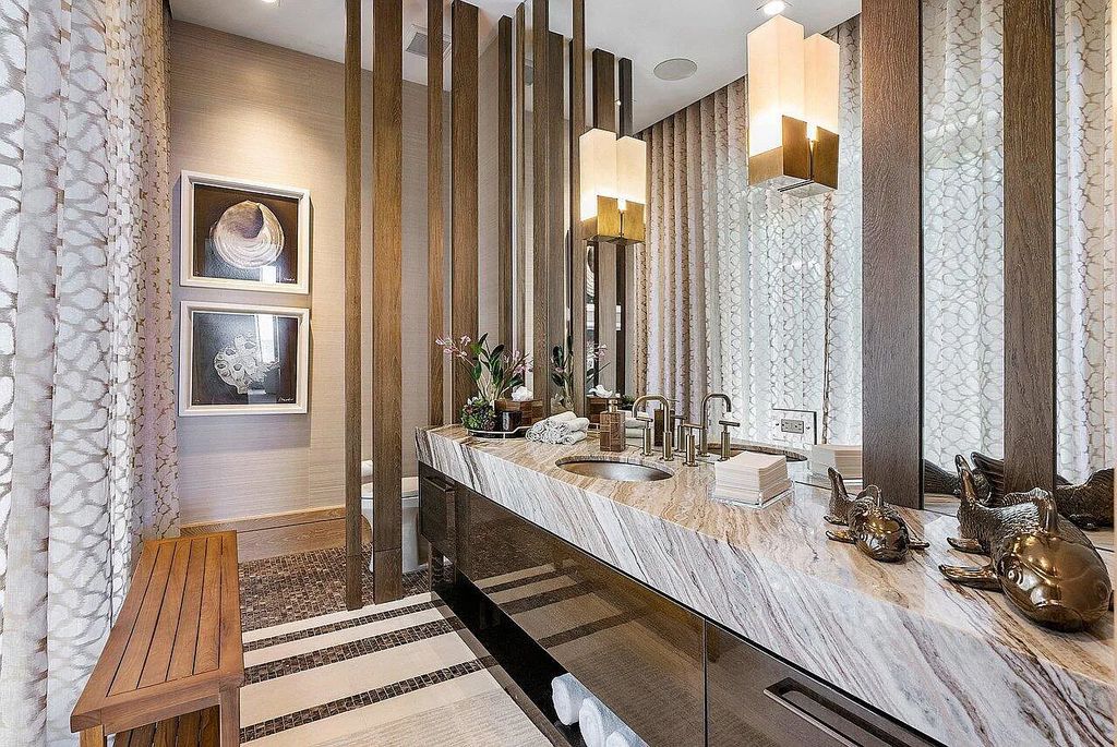Welcome to 1115 Hillsboro Mile, a luxurious 6-bedrooms, 8-bathrooms home in Hillsboro Beach, Florida. Built in 2017 by Mark Timothy Luxury Homes and Affiniti Architects, this property offers stunning ocean views and a private boat dock.
