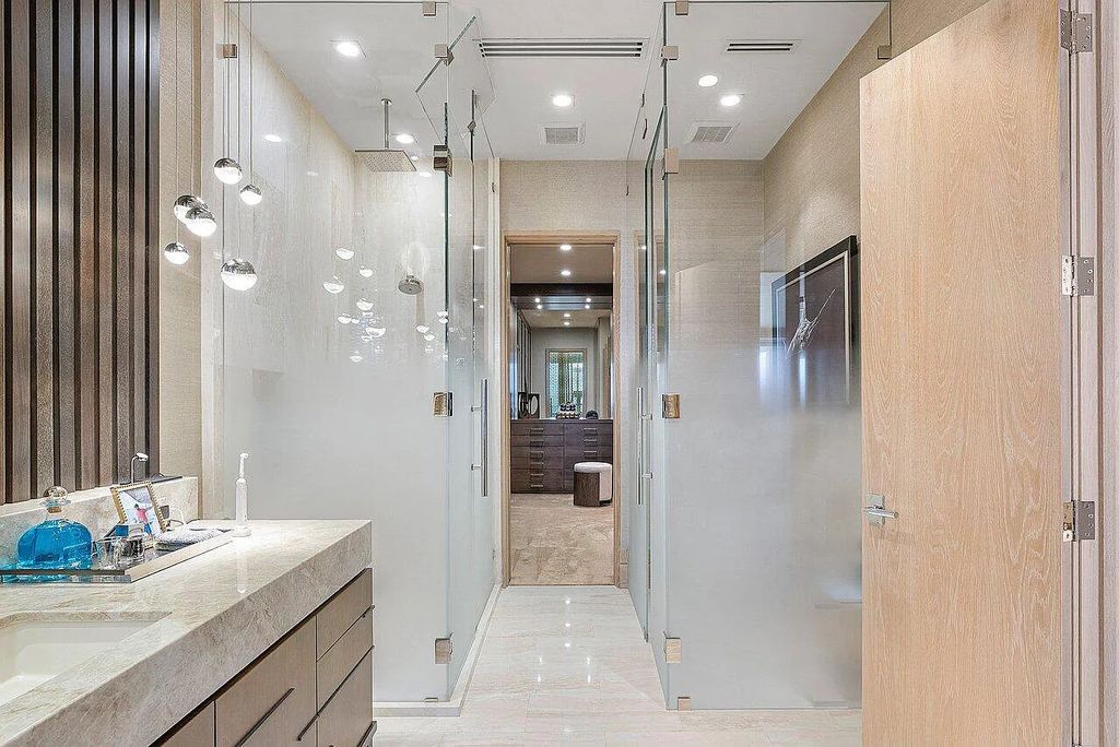 Welcome to 1115 Hillsboro Mile, a luxurious 6-bedrooms, 8-bathrooms home in Hillsboro Beach, Florida. Built in 2017 by Mark Timothy Luxury Homes and Affiniti Architects, this property offers stunning ocean views and a private boat dock.