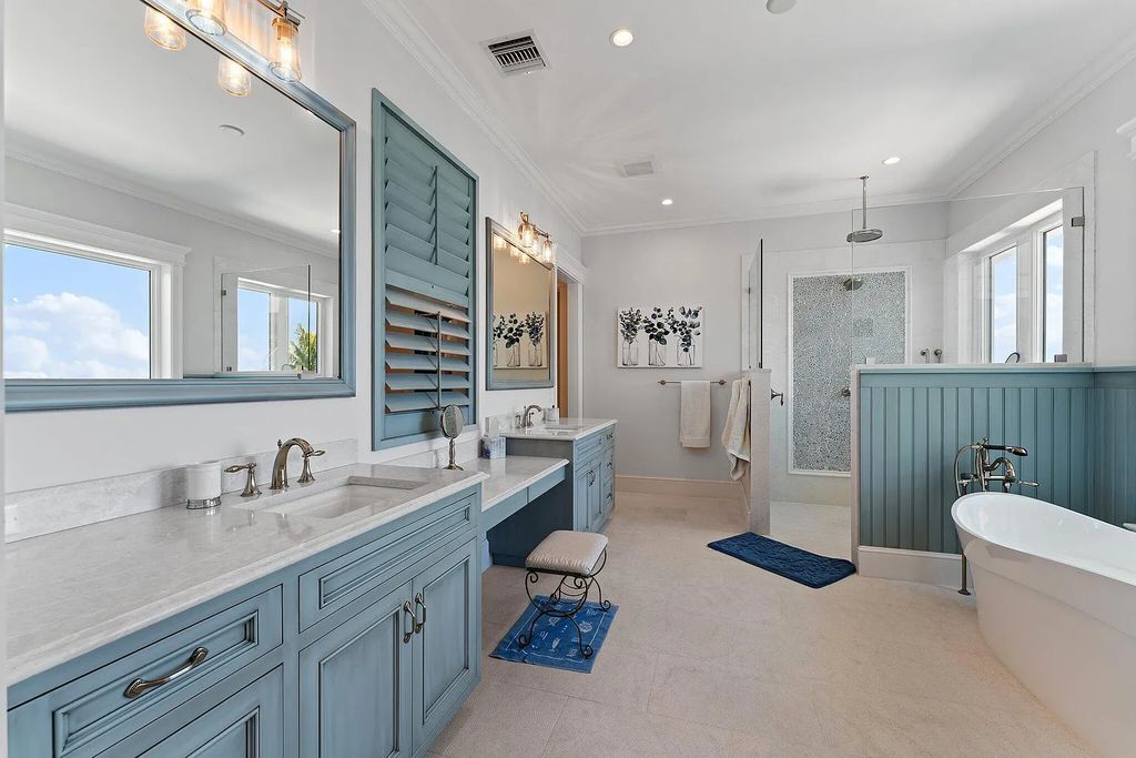 Introducing 5874 Pennock Point Road, a luxurious estate in Jupiter, Florida. This stunning property offers 5 bedrooms, 8 bathrooms, and 7,434 square feet of living space.