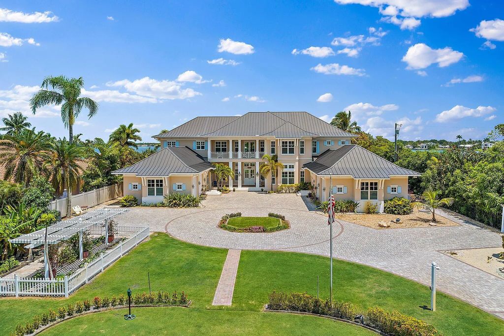 Introducing 5874 Pennock Point Road, a luxurious estate in Jupiter, Florida. This stunning property offers 5 bedrooms, 8 bathrooms, and 7,434 square feet of living space.